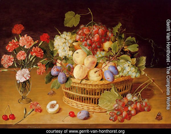 A Still Life Of A Vase Of Carnations To The Left Of A Basket Of Fruit