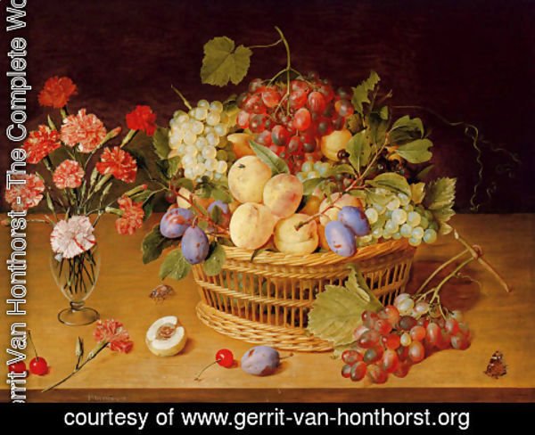 Gerrit Van Honthorst - A Still Life Of A Vase Of Carnations To The Left Of A Basket Of Fruit