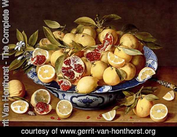 Gerrit Van Honthorst - A Still Life Of A Wanli Kraak Porcelain Bowl Of Citrus Fruit And Pomegranates On A Wooden Table